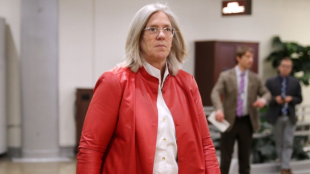 Former Principal Deputy Director of National Intelligence Sue Gordon walking to briefing