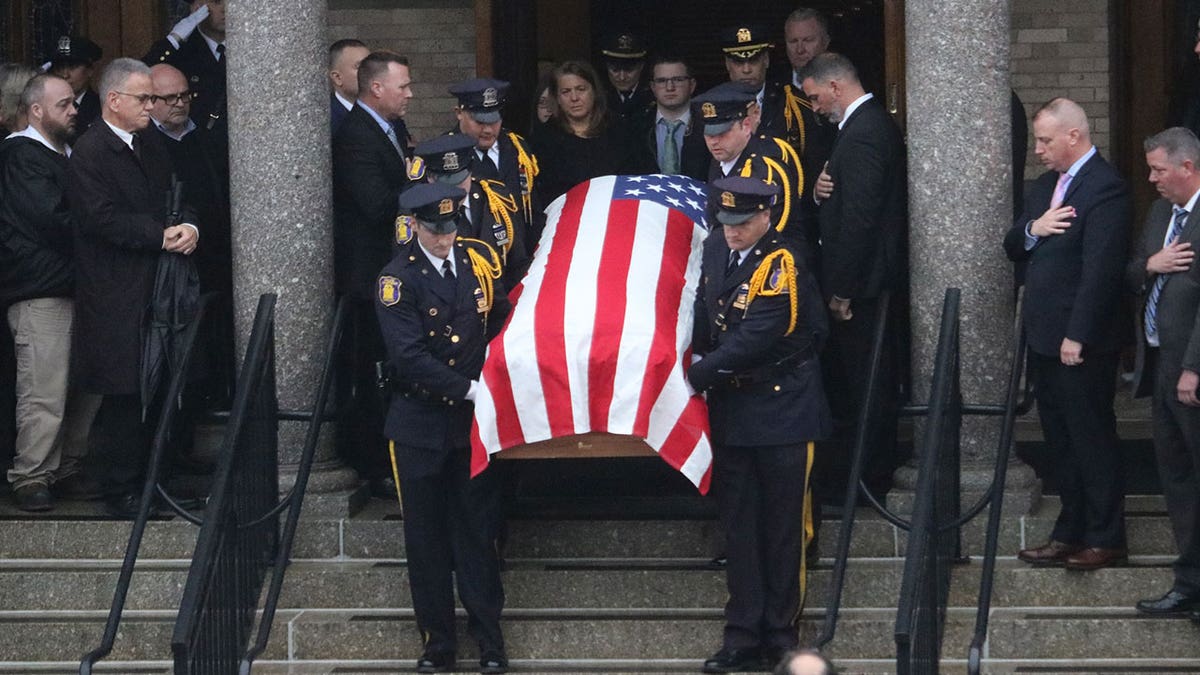 police carrying casket