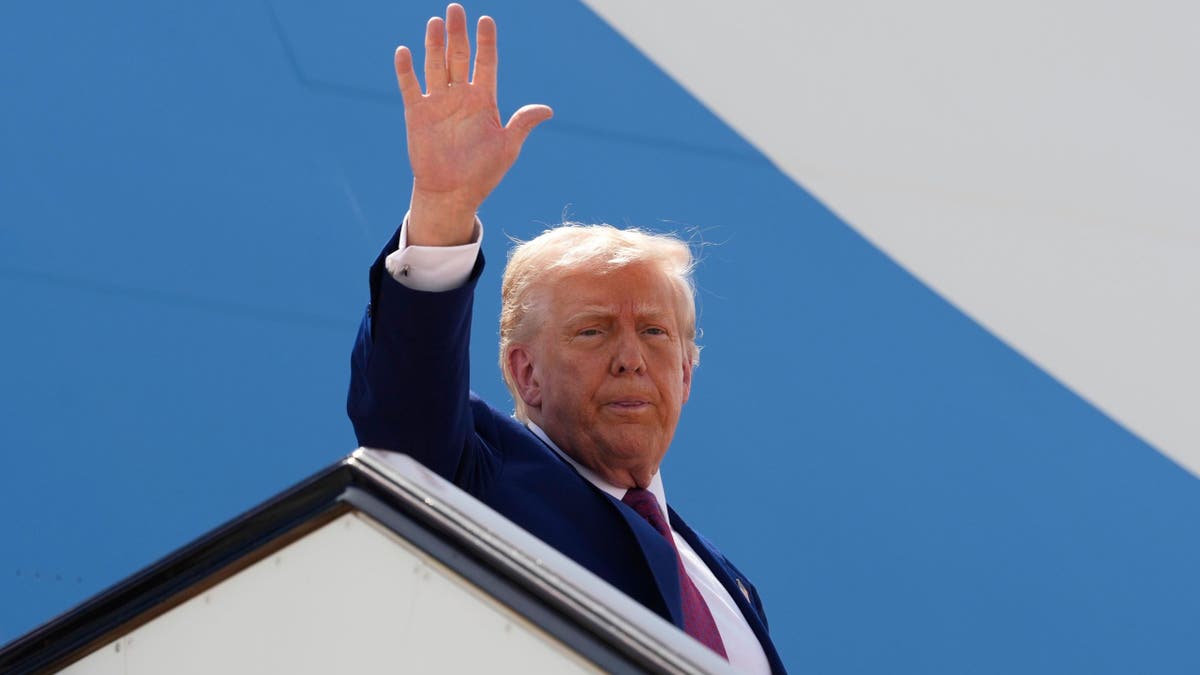 President Donald Trump waves as he boards Air Force One to depart Al Udeid Air Base on his way to the UAE on Thursday, May 15, 2025, in Doha, Qatar. 