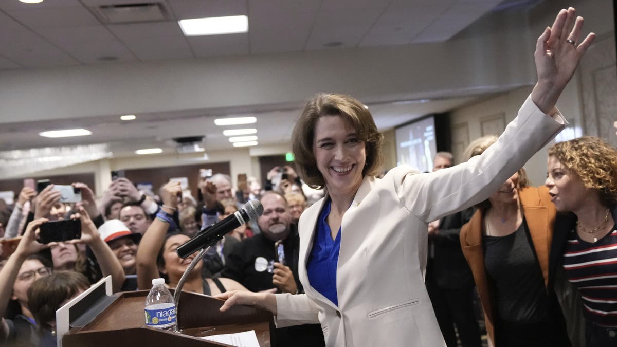 Wisconsin Supreme Court candidate Susan Crawford waves during her election night party after winning the election Tuesday, April 1, 2025, in Madison, Wis. (AP Photo/Kayla Wolf)