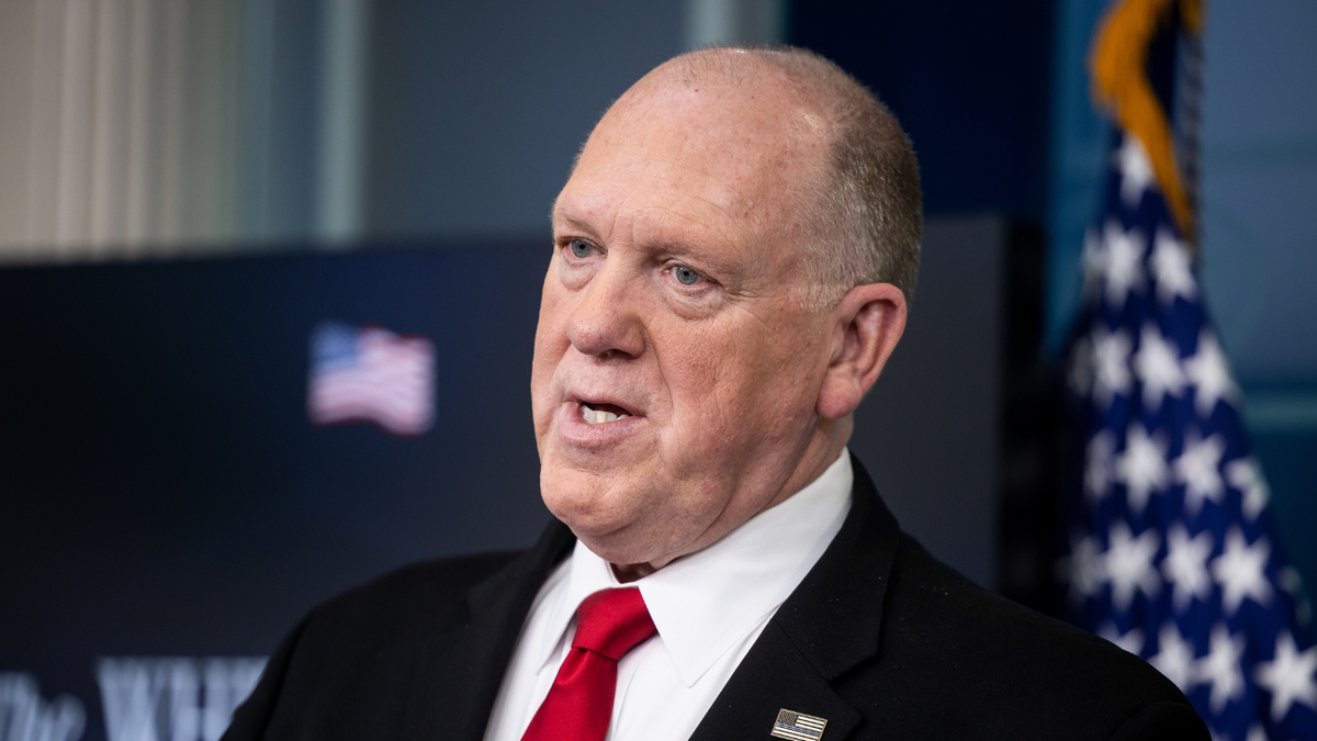 Tom Homan speaks in a suit at the White House