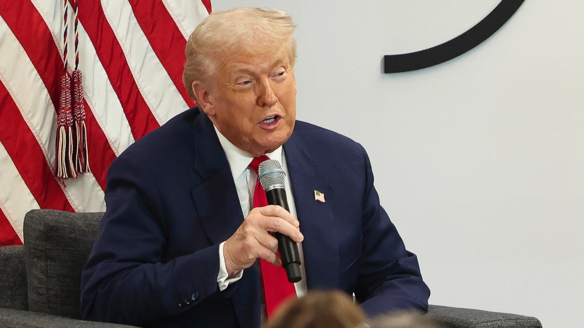 Donald Trump speaking into a microphone