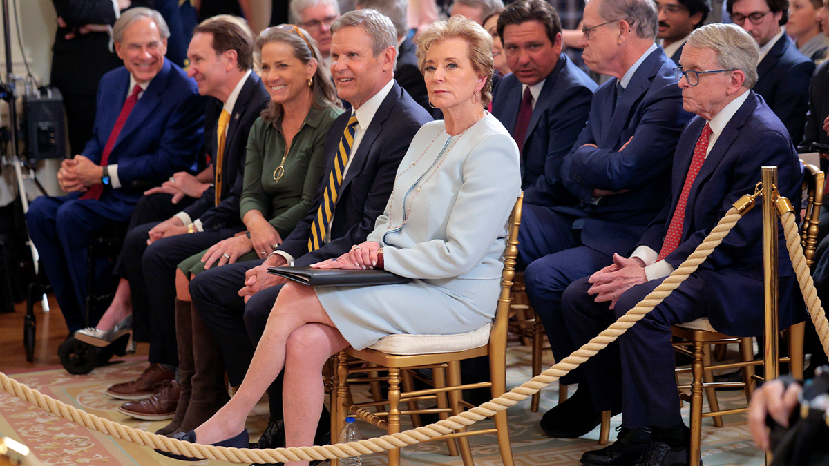 Linda McMahon with others at signing ceremony in East Room of the White House