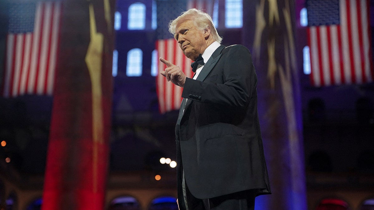 President Donald Trump on stage pointing