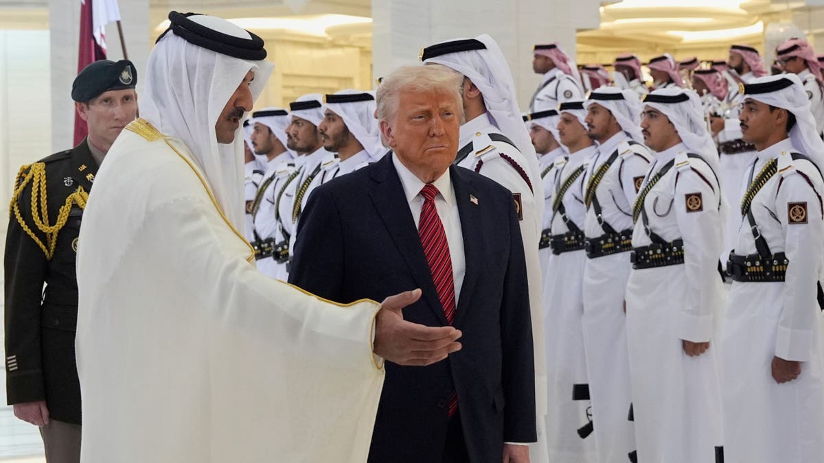 Qatar's Emir Sheikh Tamim bin Hamad Al Thani welcomes President Donald Trump during an official welcoming ceremony at the Amiri Diwan in Doha, Qatar, Wednesday, May 14, 2025. 