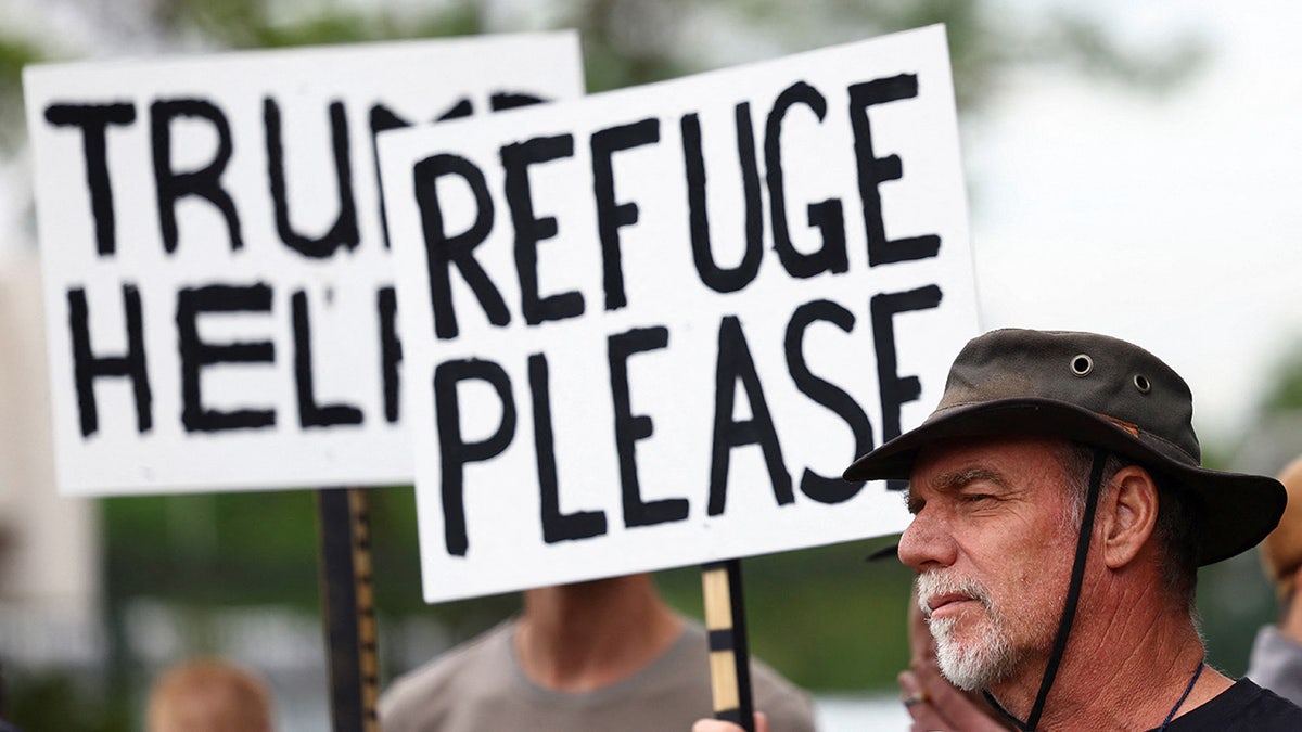 Afrikaner protesting to become a refugee