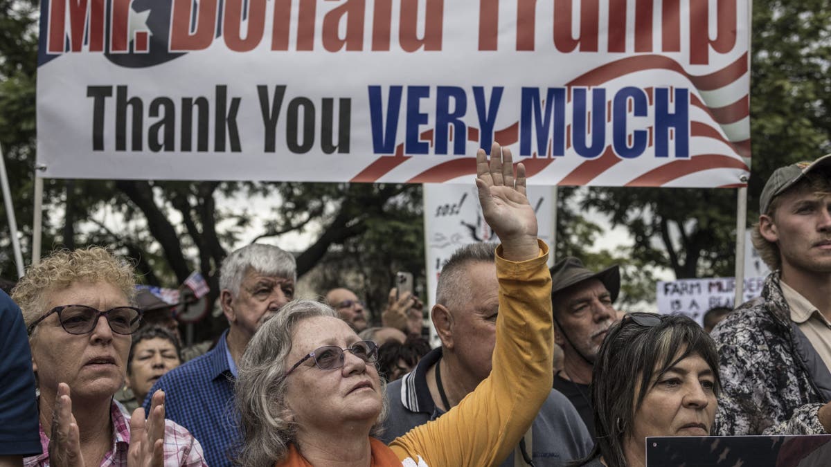 White South Africans supporting President Donald Trump and tech billionaire Elon Musk, who was born in South Africa, gather for a demonstration in front of the U.S. Embassy in Pretoria on Feb. 15, 2025.