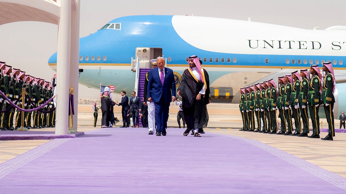 President Donald Trump, left, walks with Saudi Crown Prince Mohammed bin Salman during a welcoming ceremony in Riyadh, Saudi Arabia, on May 13, 2025.