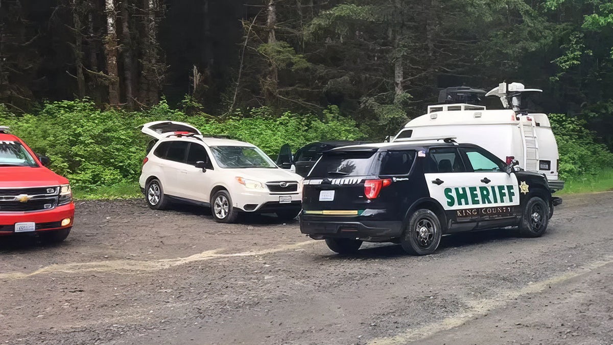 King County Sheriff's Department car and other vehicles parked