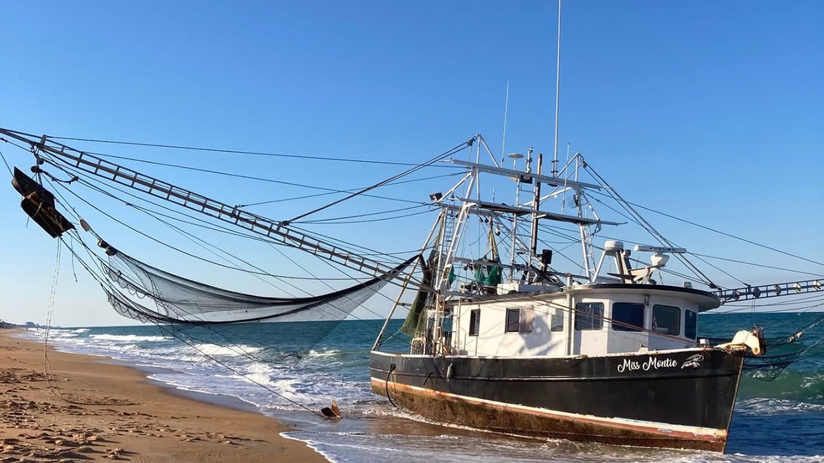 A shrimp boat washed ashore on a Florida beach on Sunday