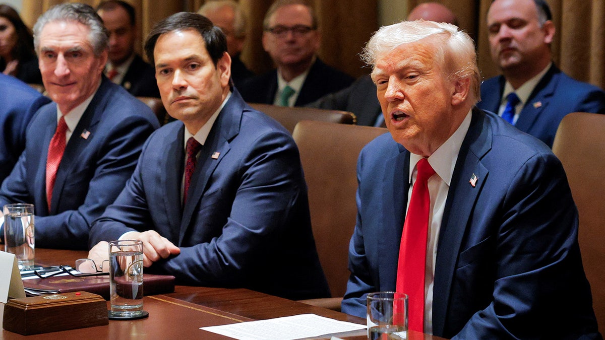 President Donald Trump speaks during a Cabinet meeting at the White House alongside Sen. Marco Rubio and Gov. Doug Burgum, addressing national security and foreign policy issues.