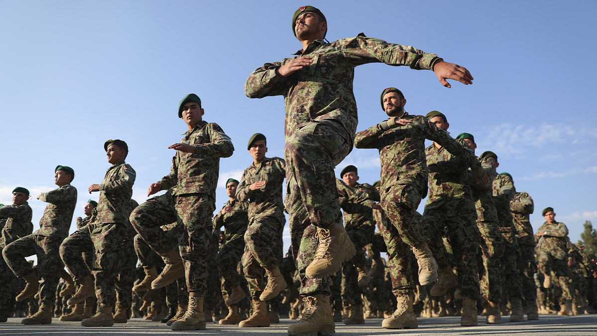 Afghan military members march in formation