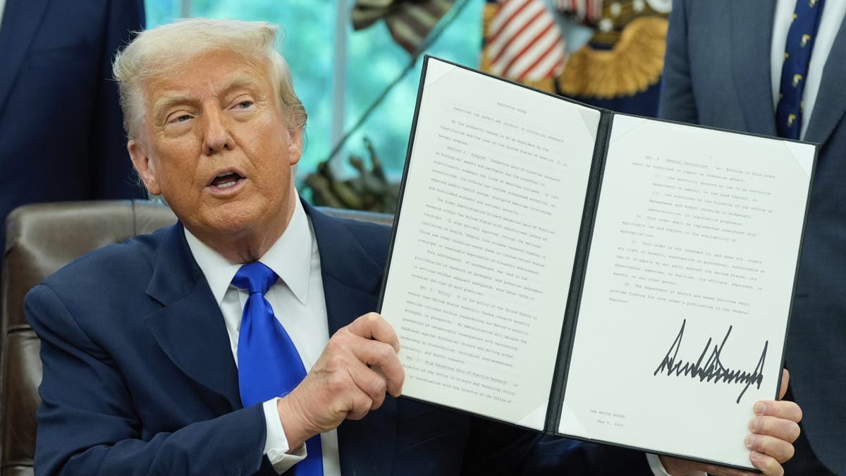 President Donald Trump signs an executive order on biomedical research safety in the Oval Office of the White House on Monday, May 5, 2025 in Washington, D.C.