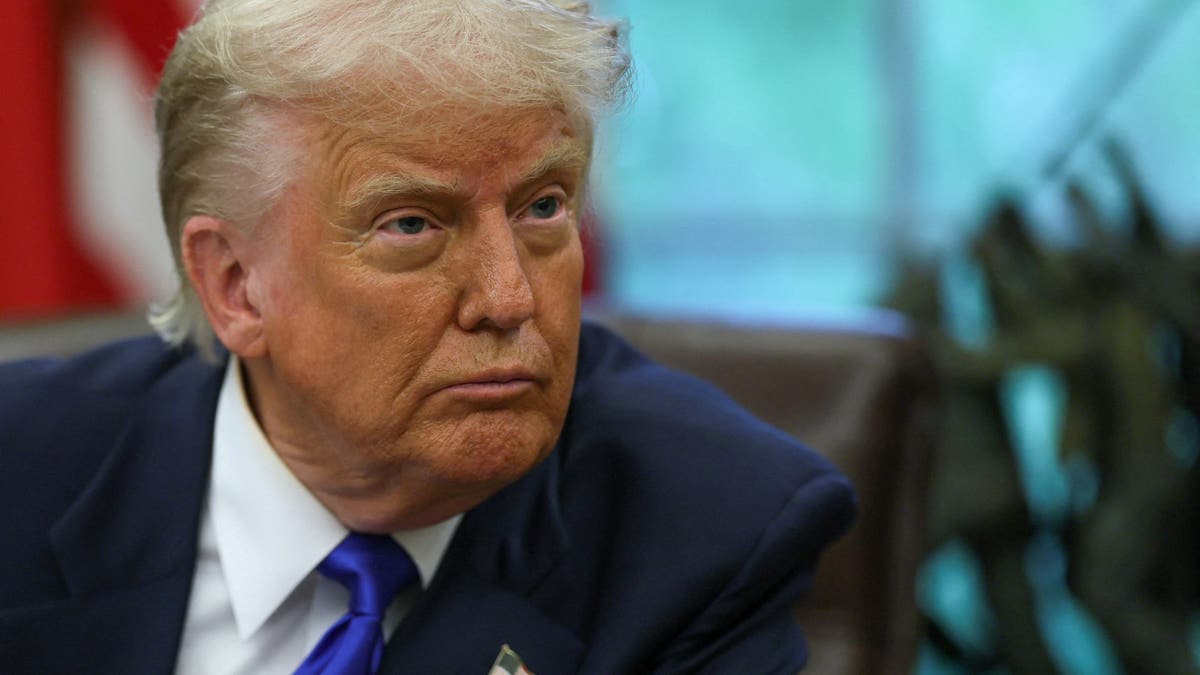  U.S. President Donald Trump looks on as he signs executive orders and proclamations in the Oval Office at the White House, in Washington, D.C., U.S., May 5, 2025.