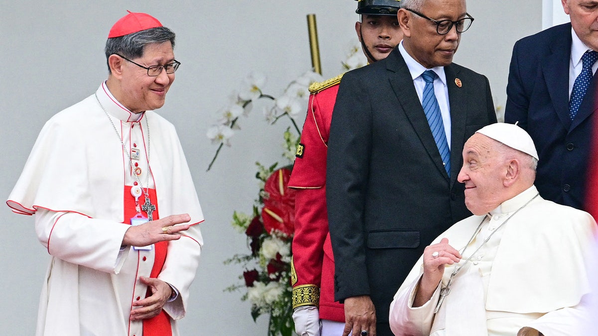 Pope Francis greets Cardinal Luis Antonio Tagle 