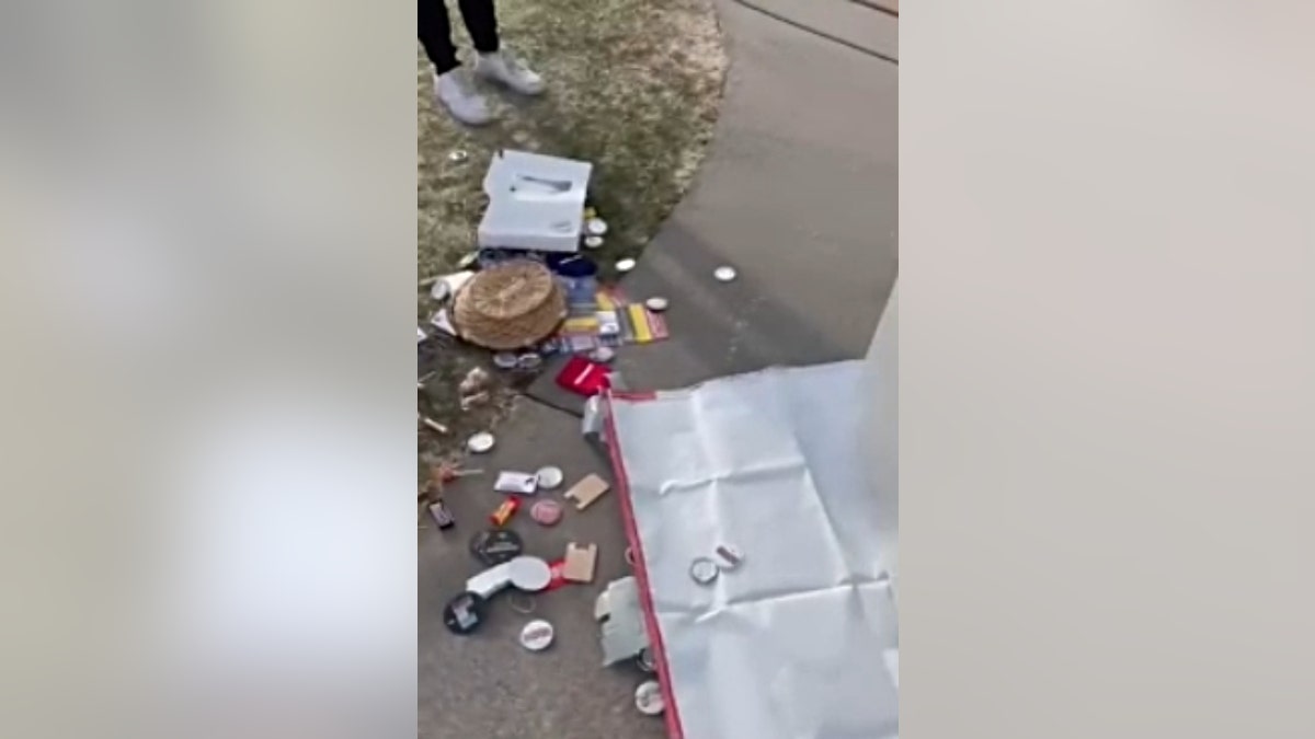 A photo showing the UW-Eau Claire College Republicans' flipped table, spilled candy and other damaged materials