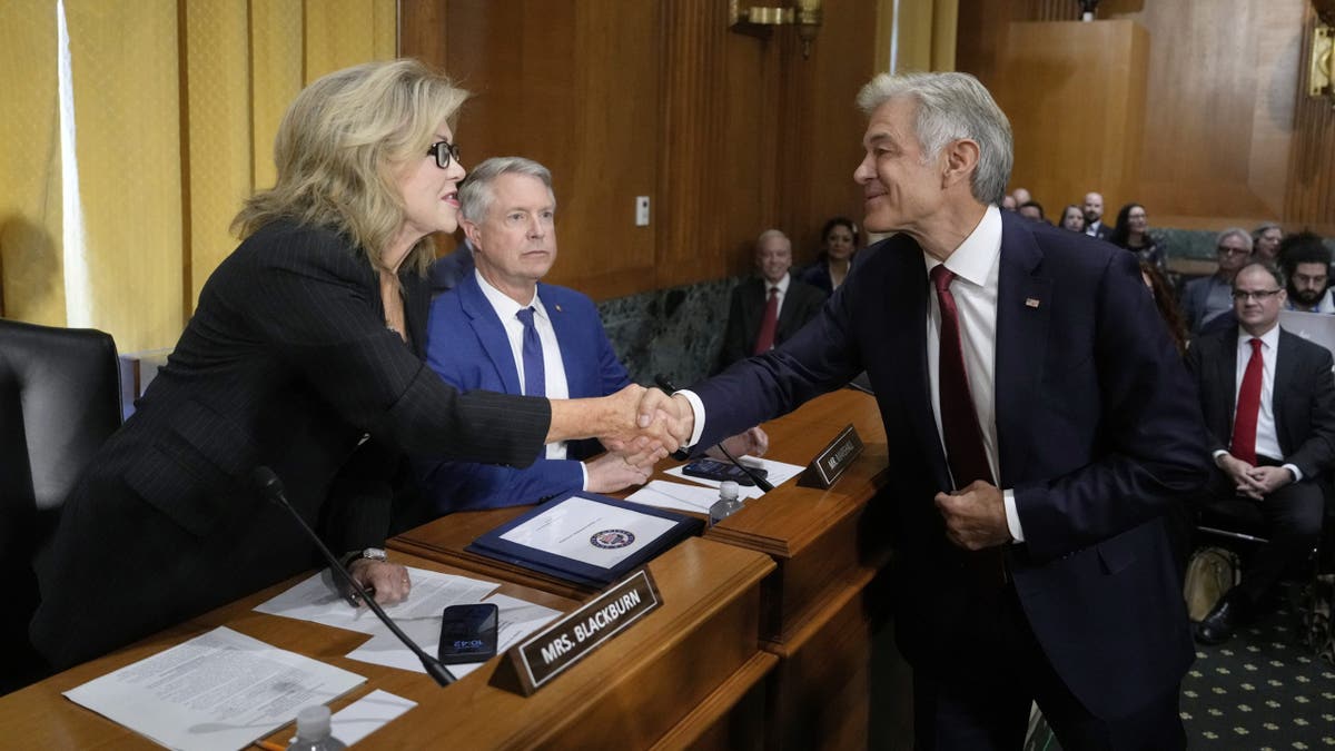 Dr. Mehmet Oz greets Sen. Marsha Blackburn, R-Tenn., as Sen. Roger Marshall, R-Kan., looks on before Oz testifies at his confirmation hearing before the Senate Finance Committee, on Capitol Hill in Washington, Friday, March 14, 2025. 