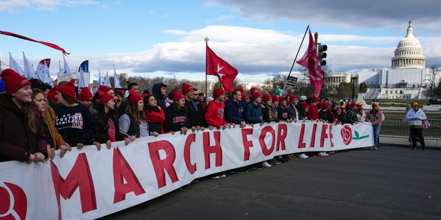 With the U.S. Capitol in the background, anti-abortion demonstrators march toward the U.S. Supreme Court during the March for Life, Friday, Jan. 20, 2023, in Washington. 