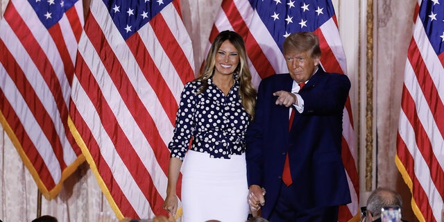 Former President Donald Trump arrives to speak with former First Lady Melania Trump, left, at his Mar-a-Lago Club in Palm Beach, Florida, on Tuesday, Nov. 15, 2022.