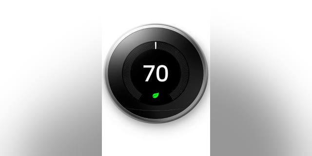 Photo of a Google Nest thermostat to help keep your house warm at a lower cost. (Credit: Google Nest)