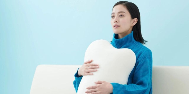 The Japanese robotics firm Yukai Engineering has invented an incredible pillow that feels like it's breathing when you hold it.