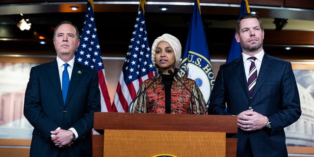 From left, Reps. Adam Schiff, D-Calif., Ilhan Omar, D-Minn., and Eric Swalwell, D-Calif., conduct a news conference on being removed from committees assignments, in the Capitol Visitor Center on Wednesday, January 25, 2023. 