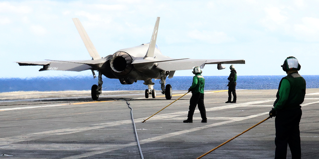 F-35C stealth jet sits on deck of USS Carl Vinson in the Western Pacific, south of Japan.