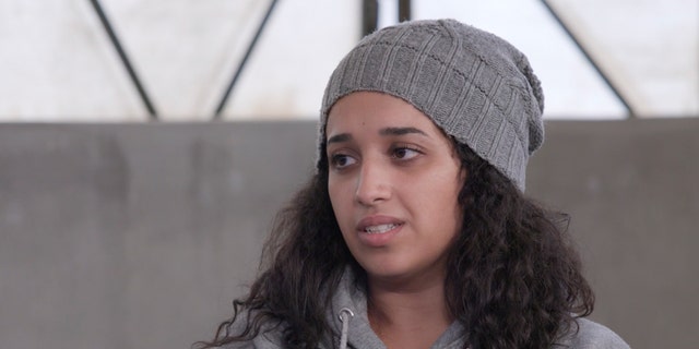In this image taken from video, Hoda Muthana talks during an interview in Roj detention camp in Syria, where she is being held by U.S.-allied Kurdish forces.