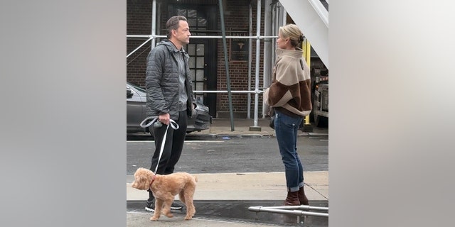 Amy Robach handed off the family dog, Brody, to her estranged husband Andrew Shue.