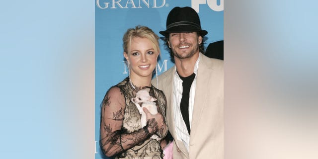 Britney Spears and Kevin Federline on the red carpet with their dog in 2004.