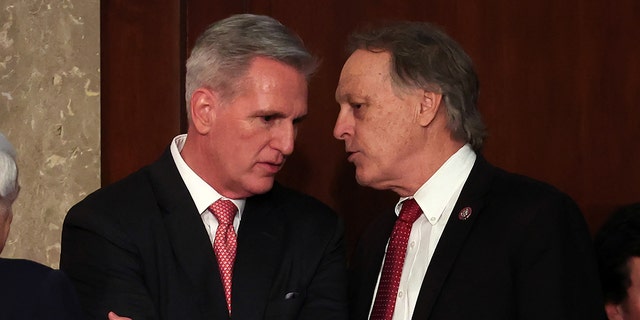 U.S. House Republican Leader Kevin McCarthy R-Calif., and Rep. Andy Biggs, R-Ariz., in the House Chamber at the U.S. Capitol Building on January 05, 2023, in Washington, DC. 