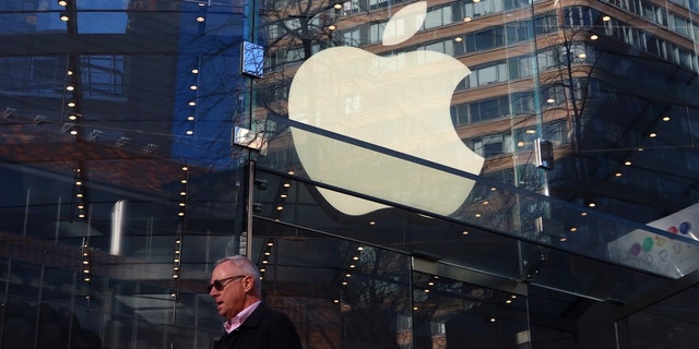 An Apple logo is displayed in the window of their Upper West Side store on Dec. 21, 2022, in New York City. 