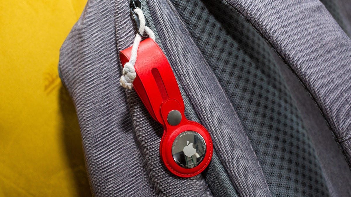 An Apple AirTag attached to a zipper