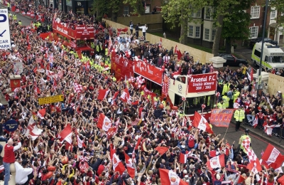 Open top bus parades began the norm for Arsenal fans, this one taking place in 2002.
