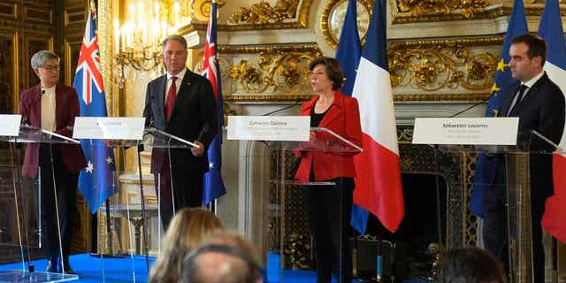 French Foreign Minister Catherine Colonna, second right, French Defense Minister Sebastien Lecornu, right, attend a joint press conference with Australian Defense Minister Richard Marles, second left, and Australian Foreign Minister Penny Wong, on Jan. 30, 2023. Australia and France are jointly sending artillery shells to Ukraine.