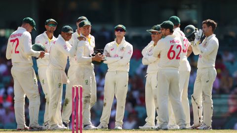 Australia's men's cricket team gather during a Test match against South Africa at the Sydney Cricket Ground on January 8, 2023.