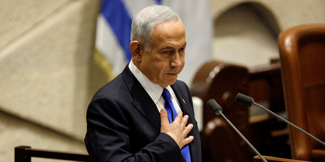 Benjamin Netanyahu speaks during a special session of the Knesset, Israel's parliament, to approve and swear in a new right-wing government, in Jerusalem on Dec. 29.
