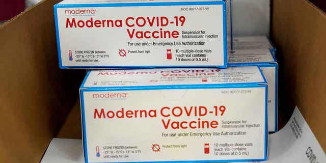 Boxes containing the Moderna COVID-19 vaccine are prepared to be shipped at a distribution center in Olive Branch, Mississippi, U.S. December 20, 2020.