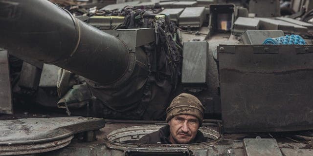 A Ukrainian soldier drives a tank on the Donbass frontline as military mobility continues within the Russian-Ukrainian war on January 18, 2023. (Photo by Diego Herrera Carcedo/Anadolu Agency via Getty Images)