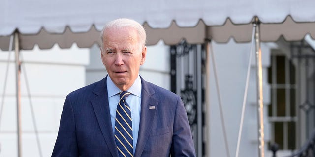 President Joe Biden walks over to talk with reporters before he and first lady Jill Biden board Marine One on the South Lawn of the White House in Washington, Wednesday, Jan. 11, 2023.