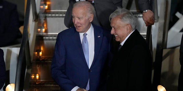 U.S. President Joe Biden is greeted by Mexican President Andres Manuel Lopez Obrador at his arrival to the Felipe Angeles international airport in Zumpango, Mexico, Sunday, Jan. 8, 2023. 