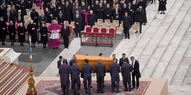 The coffin of late Pope Emeritus Benedict XVI is brought to St. Peter's Square for a funeral mass at the Vatican, Thursday, Jan. 5, 2023