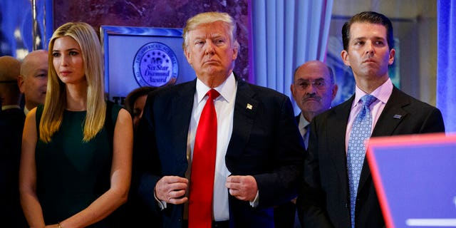 President-elect Donald Trump, Donald Trump Jr. and Ivanka Trump at a news conference in the lobby of Trump Tower in New York. (AP Photo/Evan Vucci)