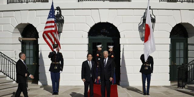 President Biden poses for photographs with Japanese Prime Minister Kishida Fumio after his arrival at the White House on Jan. 13, 2023, in Washington, D.C. 