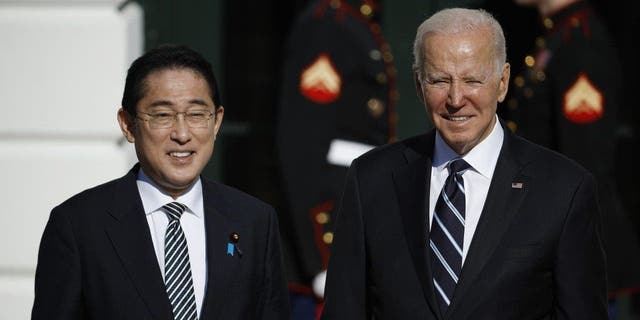President Biden poses for photographs with Japanese Prime Minister Kishida Fumio after his arrival at the White House on Jan. 13, 2023, in Washington, D.C.