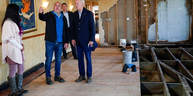 President Joe Biden talks with Paradise Beach Grille co-owners Chuck Maier and Ally Gotlieb, left, as he visitswith business owners and local residentsin Capitola,Calif., Thursday, Jan 19, 2023,to survey recovery efforts following a series of severe storms. 