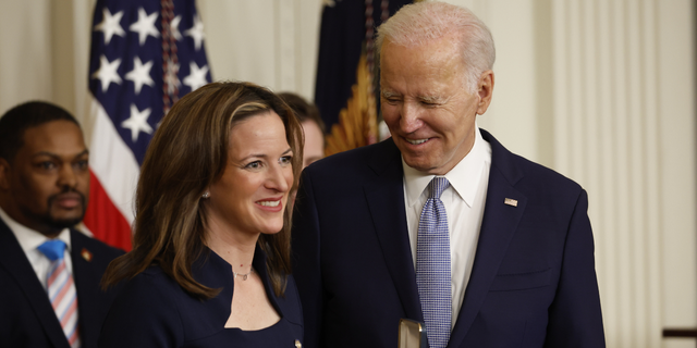 Jocelyn Benson, Michigan's secretary of state, receives the Presidential Citizens Medal from US President Joe Biden, right, during a ceremony at the White House marking the two-year anniversary of the January 6 insurrection at the US Capitol in Washington, DC, US, on Friday, Jan. 6, 2023. 