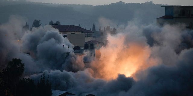 Israeli troops blow up the house of Palestinian militant Diaa Hamarsheh in the West Bank village of Yabed, Thursday, June 2, 2022. Israeli officials say the demolitions deter future attacks, while rights groups view it as a form of collective punishment.