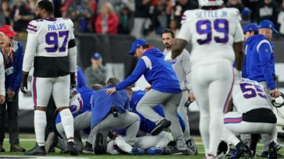 Hamlin is examined after collapsing on the field in the first quarter of Monday night's game between the Buffalo Bills and Cincinnati Bengals. 