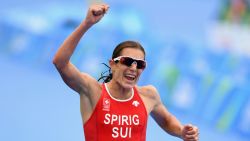 RIO DE JANEIRO, BRAZIL - AUGUST 20:  Nicola Spirig Hug of Switzerland celebrates as she approaches the line to win silver during the Women's Triathlon on Day 15 of the Rio 2016 Olympic Games at Fort Copacabana on August 20, 2016 in Rio de Janeiro, Brazil.  (Photo by Quinn Rooney/Getty Images)